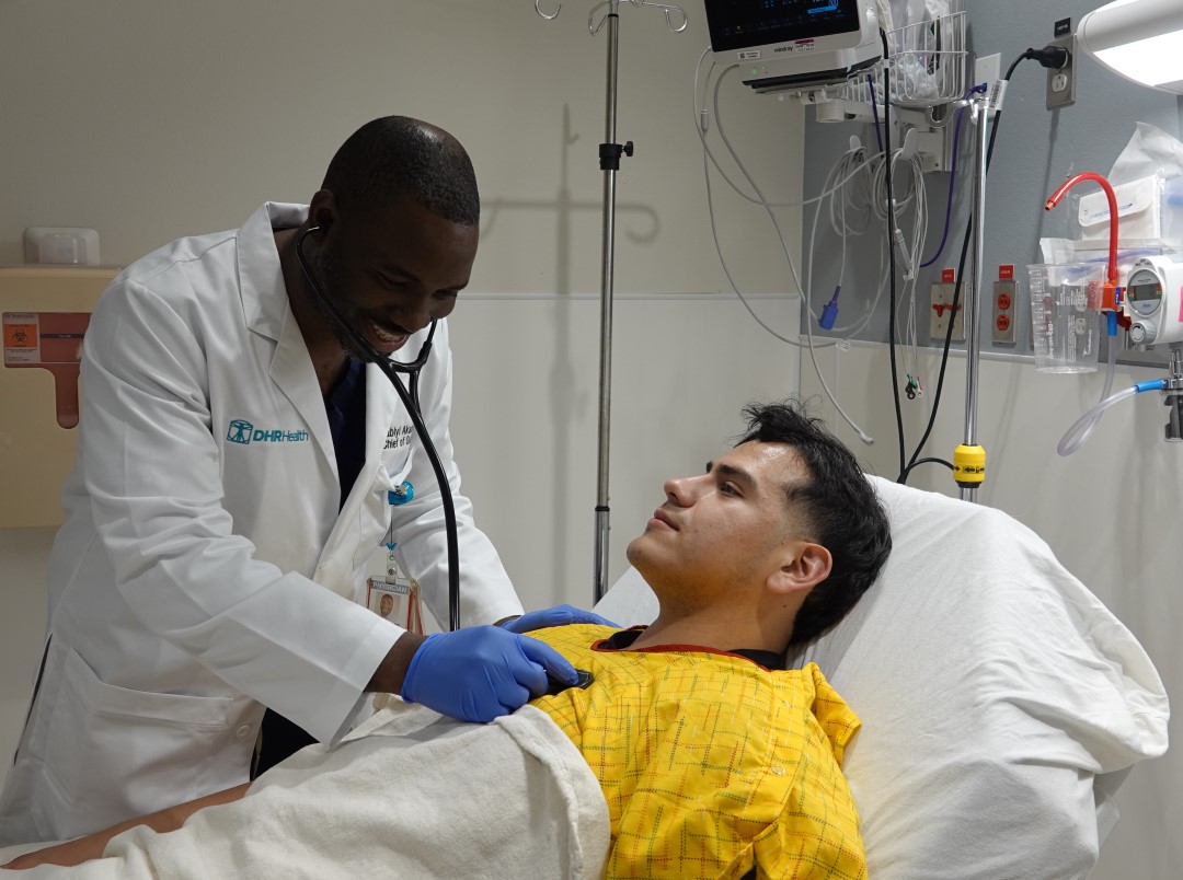 Dr. Akala Listening To Patient